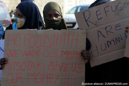 Migrants and refugees in Greek camp protesting about food provision. 