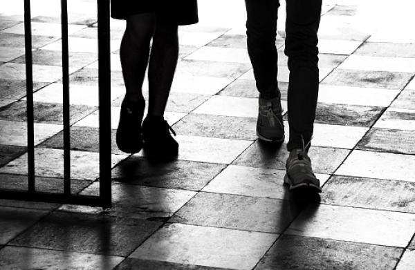 Girl and guy walking alongside