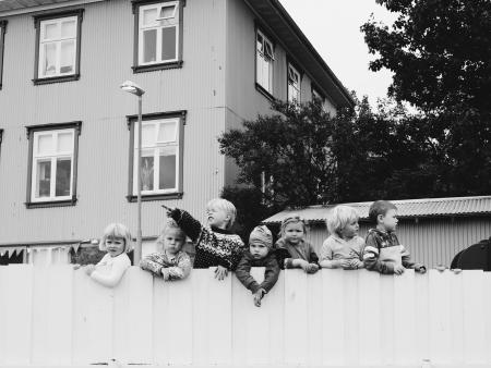 childrens on a fence